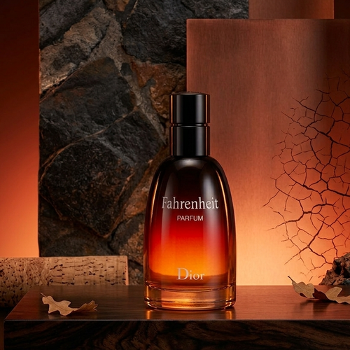 Dior Fahrenheit Parfum bottle displayed on a dark wooden surface with a textured stone and wood backdrop, lit by warm orange lighting.